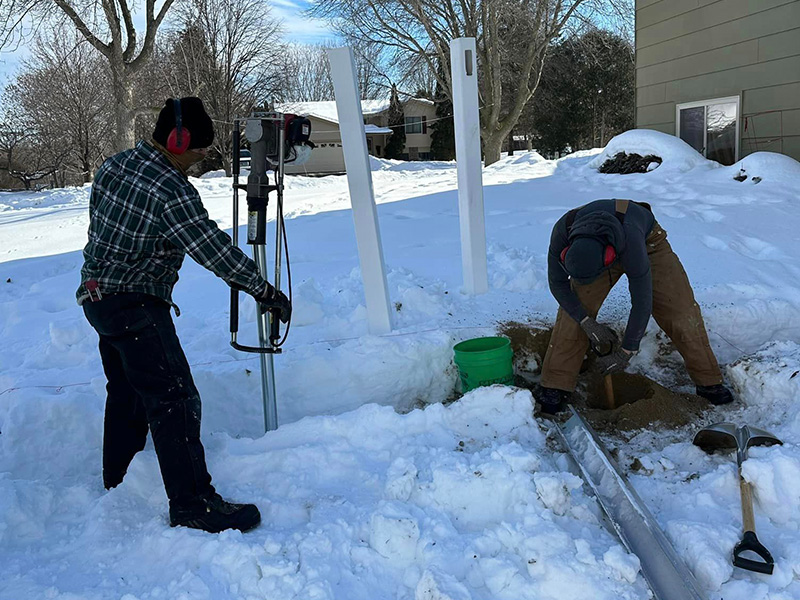 Local fence contractor driving posts  Mankato Minnesota Minnesota